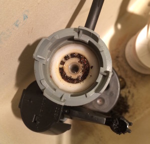 If your toilet is running, check the valve inside and see if it's clogged with little gravel particles like the valve in this picture. Remove the debris and you are good to go!